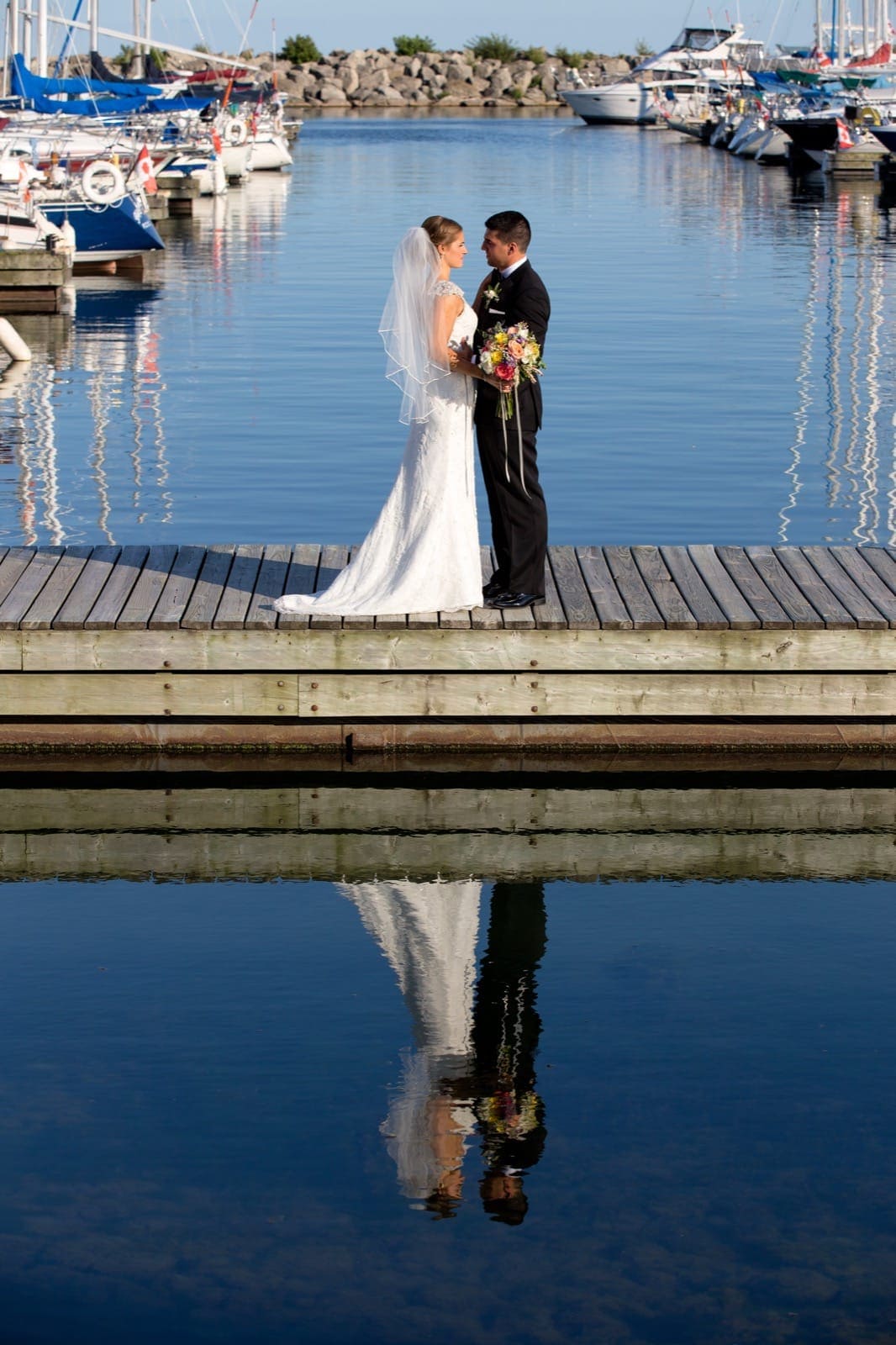 Oakville wedding photography couple over water